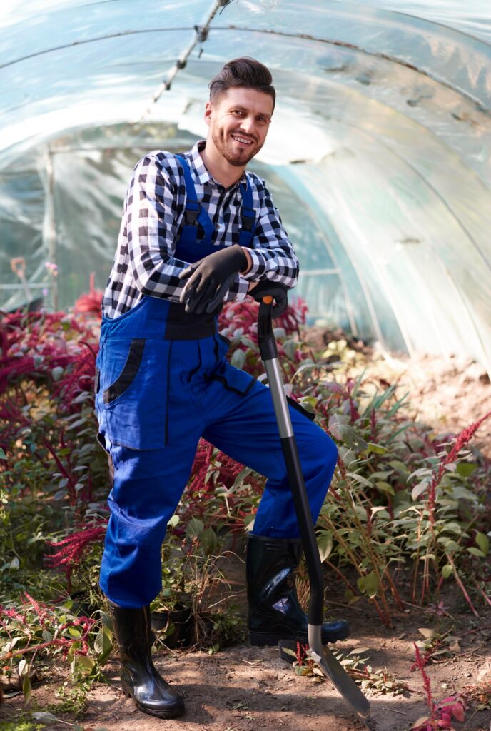 Gardener leaning against a shovel